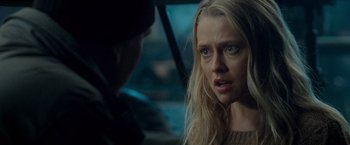 Movie still from “Warm Bodies” (2013), directed by Jonathan Levine – A young woman in a sweater is talking to a young man; Close Up shot, Over the shoulder angle