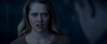 Movie still from “Warm Bodies” (2013), directed by Jonathan Levine – A young woman with long blonde hair stares into the camera; Close Up shot, Over the shoulder angle