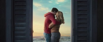 Movie still from “Warm Bodies” (2013), directed by Jonathan Levine – A man and a woman standing next to each other in front of the ocean; Medium shot, Low angle