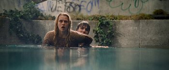 Movie still from “Warm Bodies” (2013), directed by Jonathan Levine – A man and a woman in a pool of water; Medium shot, Low angle