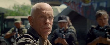 Movie still from “Warm Bodies” (2013), directed by Jonathan Levine – An older man with a hat is looking at the camera; Close Up shot, Low angle