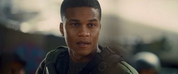 Movie still from “Warm Bodies” (2013), directed by Jonathan Levine – A person with a gun in his hand; Close Up shot, Over the shoulder angle