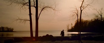 Movie still from “Warm Bodies” (2013), directed by Jonathan Levine – A man standing on the shore of a body of water; Extreme Wide shot, Low angle