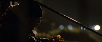 Movie still from “Warrior” (2011), directed by Gavin O'Connor – A man holding an object in his hands; Close Up shot, Low angle