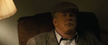 Movie still from “Warrior” (2011), directed by Gavin O'Connor – An older man wearing a hat and a jacket; Close Up shot, Low angle