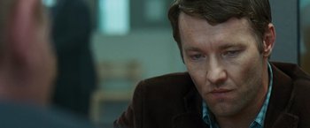 Movie still from “Warrior” (2011), directed by Gavin O'Connor – A person wearing a suit and tie; Close Up shot, Over the shoulder angle