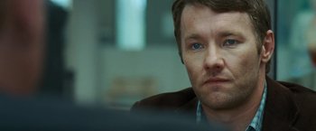 Movie still from “Warrior” (2011), directed by Gavin O'Connor – A person wearing a suit and tie; Close Up shot, Over the shoulder angle