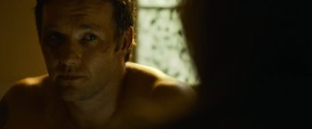 Movie still from “Warrior” (2011), directed by Gavin O'Connor – A man's chest and chest hair; Close Up shot, Over the shoulder angle