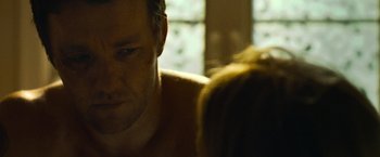 Movie still from “Warrior” (2011), directed by Gavin O'Connor – A man and a woman in a room; Close Up shot, Over the shoulder angle
