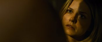 Movie still from “Warrior” (2011), directed by Gavin O'Connor – A woman's face in the dark; Close Up shot, Over the shoulder angle