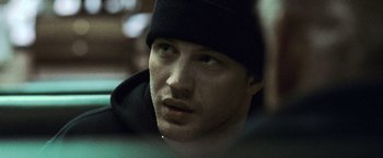 Movie still from “Warrior” (2011), directed by Gavin O'Connor – A person wearing a hat; Close Up shot, Over the shoulder angle