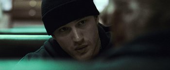 Movie still from “Warrior” (2011), directed by Gavin O'Connor – A person wearing a hat; Close Up shot, Over the shoulder angle