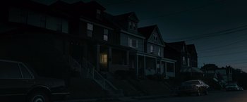 Movie still from “Warrior” (2011), directed by Gavin O'Connor – A row of houses in the dark of a night; Extreme Wide shot, Low angle