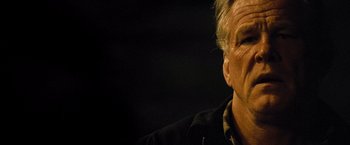 Movie still from “Warrior” (2011), directed by Gavin O'Connor – An older man is looking at the camera; Close Up shot, Low angle