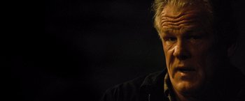 Movie still from “Warrior” (2011), directed by Gavin O'Connor – An older man is looking at the camera; Close Up shot, Low angle