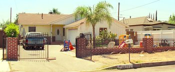 Movie still from “Warrior” (2011), directed by Gavin O'Connor – A house that has a fence around it; Extreme Wide shot, High angle