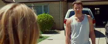 Movie still from “Warrior” (2011), directed by Gavin O'Connor – A man and a woman walking down a sidewalk; Medium shot, Over the shoulder angle