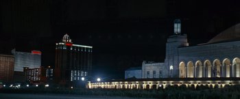 Movie still from “Warrior” (2011), directed by Gavin O'Connor – A night time view of a city with lights on; Extreme Wide shot, Low angle