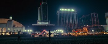 Movie still from “Warrior” (2011), directed by Gavin O'Connor – A person standing on a beach at night; Extreme Wide shot, Low angle