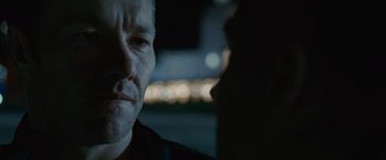 Movie still from “Warrior” (2011), directed by Gavin O'Connor – A man's face in the dark; Close Up shot, Over the shoulder angle