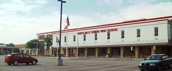 Movie still from “Warrior” (2011), directed by Gavin O'Connor – A building that reads north hills senior high school; Extreme Wide shot, Low angle