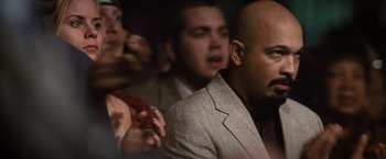 Movie still from “Warrior” (2011), directed by Gavin O'Connor – A group of people sitting in front of a camera; Close Up shot, Over the shoulder angle