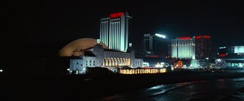 Movie still from “Warrior” (2011), directed by Gavin O'Connor – A night time view of a casino and a hotel; Extreme Wide shot, Low angle