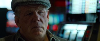 Movie still from “Warrior” (2011), directed by Gavin O'Connor – An older man wearing a hat and looking at the camera; Close Up shot, Low angle