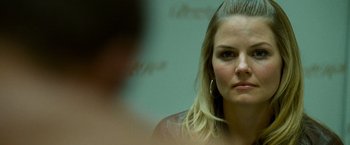 Movie still from “Warrior” (2011), directed by Gavin O'Connor – A woman's face in front of a mirror; Close Up shot, Over the shoulder angle