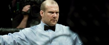 Movie still from “Warrior” (2011), directed by Gavin O'Connor – A man in a bow tie and a dress shirt; Close Up shot, Low angle