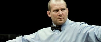 Movie still from “Warrior” (2011), directed by Gavin O'Connor – A man in a bow tie and a dress shirt; Close Up shot, Low angle