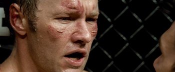 Movie still from “Warrior” (2011), directed by Gavin O'Connor – A man's face with blood all over his face; Close Up shot, Over the shoulder angle