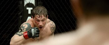 Movie still from “Warrior” (2011), directed by Gavin O'Connor – A person in a boxing ring; Close Up shot, Over the shoulder angle