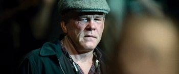 Movie still from “Warrior” (2011), directed by Gavin O'Connor – A person wearing a hat; Close Up shot, Over the shoulder angle