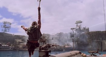 Movie still from “Waterworld” (1995), directed by Kevin Reynolds – A person jumping in the air over a body of water; Wide shot, Low angle