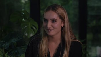 Movie still from “We Feed People” (2022), directed by Ron Howard – A beautiful young lady with long blonde hair; Close Up shot, Over the shoulder angle