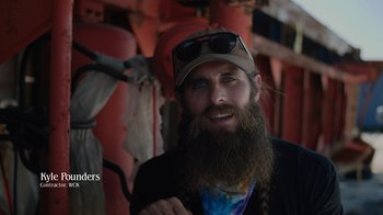 Movie still from “We Feed People” (2022), directed by Ron Howard – A man with a long beard wearing a hat; Close Up shot, Overhead angle