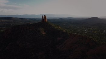 Movie still from “We Feed People” (2022), directed by Ron Howard – A group of people standing on top of a hill; Extreme Wide shot, High angle