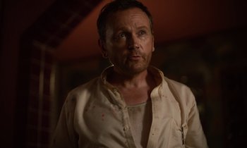 A person wearing a white shirt