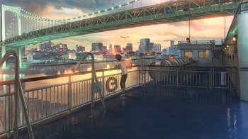 Movie still from “Weathering with You” (2019), directed by Makoto Shinkai – A man standing on a bridge looking at a city; Extreme Wide shot, High angle