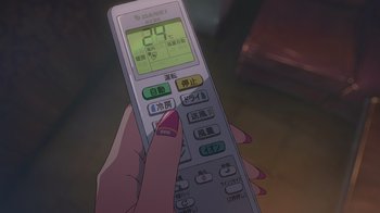 Movie still from “Weathering with You” (2019), directed by Makoto Shinkai – A person holding a remote control in their hand; Extreme Close Up shot, High angle