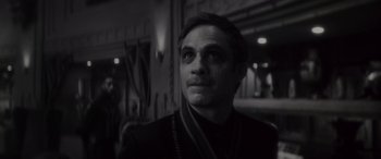 Movie still from “Werewolf by Night” (2022), directed by Michael Giacchino – Black and white photograph of a man looking up; Close Up shot, Over the shoulder angle