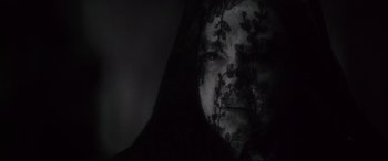 Movie still from “Werewolf by Night” (2022), directed by Michael Giacchino – A woman in a black dress with a veil on her face; Extreme Close Up shot, Low angle