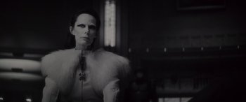 Movie still from “Werewolf by Night” (2022), directed by Michael Giacchino – A black and white photo of a woman in a white dress; Close Up shot, Low angle