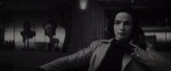 Movie still from “Werewolf by Night” (2022), directed by Michael Giacchino – A black and white photo of a woman in a leather jacket; Close Up shot, Low angle