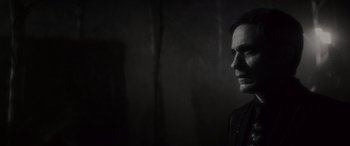 Movie still from “Werewolf by Night” (2022), directed by Michael Giacchino – A black and white photo of a man's face; Close Up shot, Over the shoulder angle