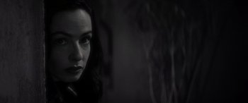 Movie still from “Werewolf by Night” (2022), directed by Michael Giacchino – A black and white photo of a woman's face; Close Up shot, Over the shoulder angle