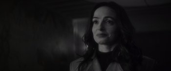 Movie still from “Werewolf by Night” (2022), directed by Michael Giacchino – A black and white photo of a woman looking at the camera; Close Up shot, Over the shoulder angle