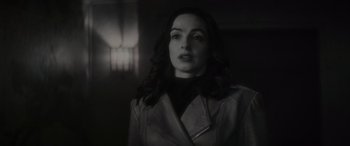Movie still from “Werewolf by Night” (2022), directed by Michael Giacchino – A black and white photo of a woman in a jacket; Close Up shot, Low angle