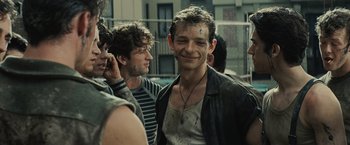 Movie still from “West Side Story” (2021), directed by Steven Spielberg – A group of young men standing next to each other; Close Up shot, Low angle